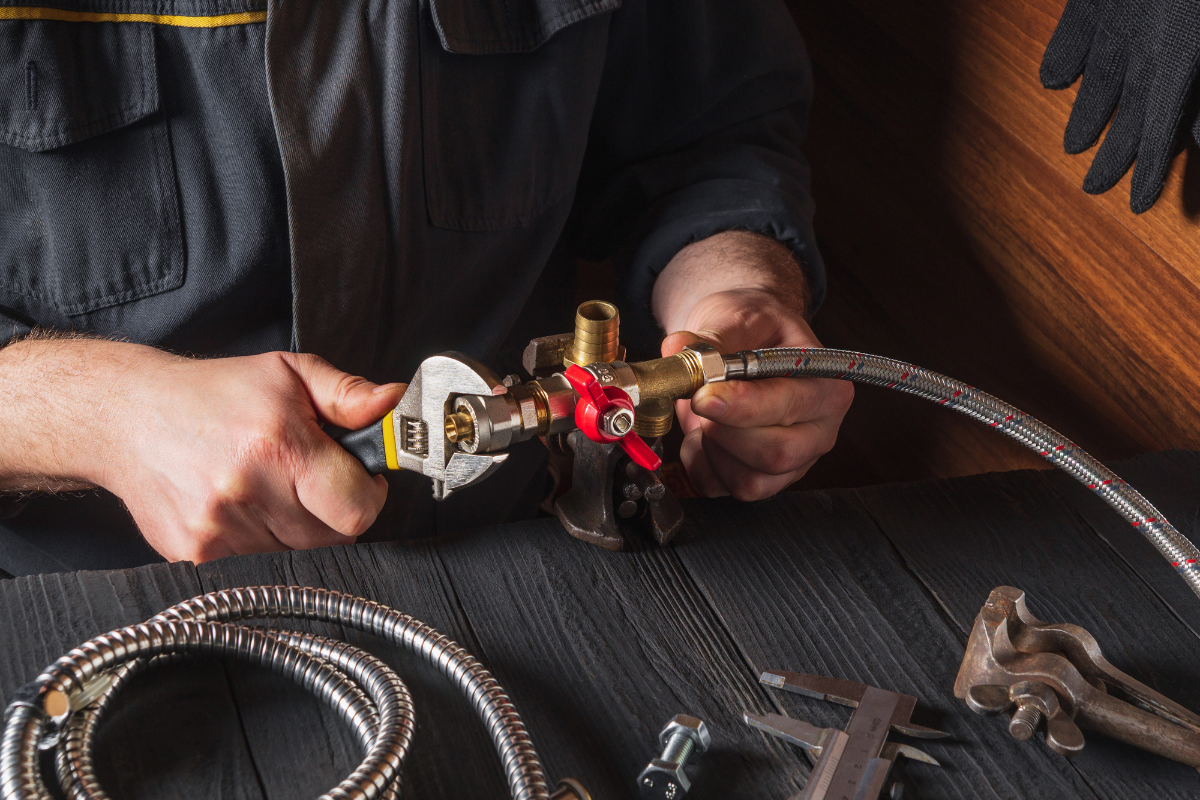 Professional plumber repairing plumbing
